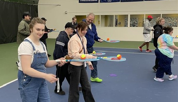 Patrons participating in a tennis program at the Babette Horenstein Tennis Center.