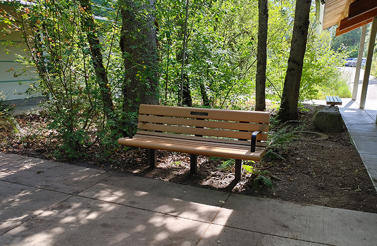 Tualatin Hills Nature Park bench with an embedded memorial plaque